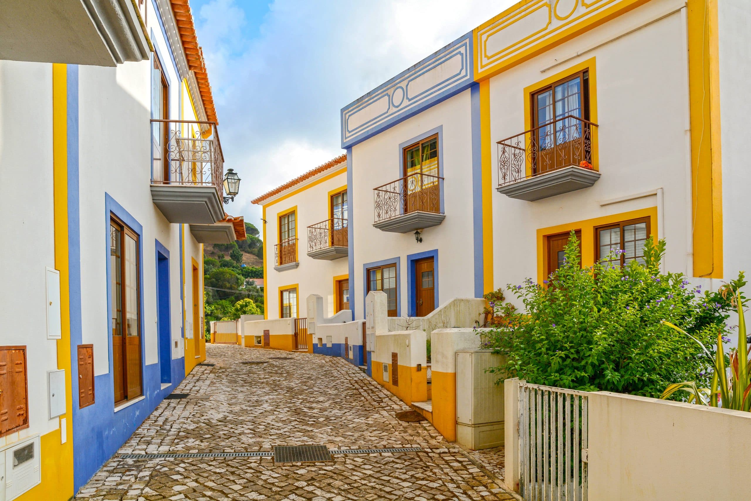 Village street with residential buildings in the town of Bordeira near Carrapateira, Municipality of Aljezur, District of Faro, Algarve Portugal